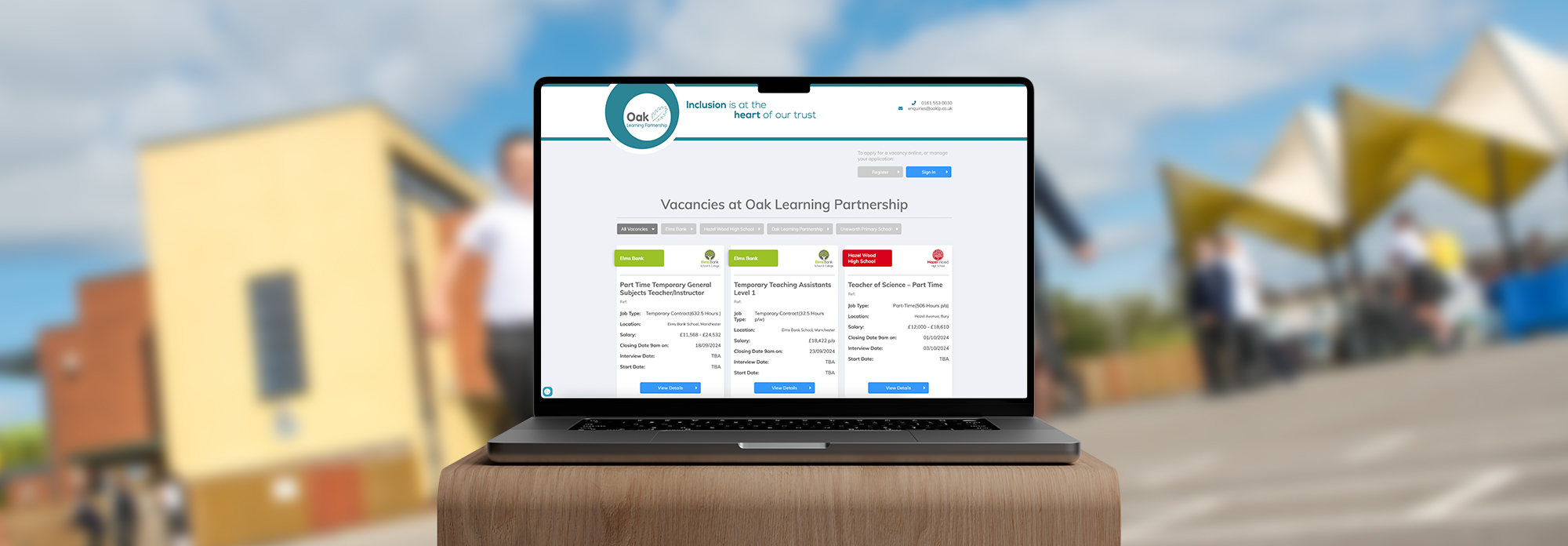 The image shows a laptop with a visual of a vacancies portal website showing multiple vacancies for a trust.