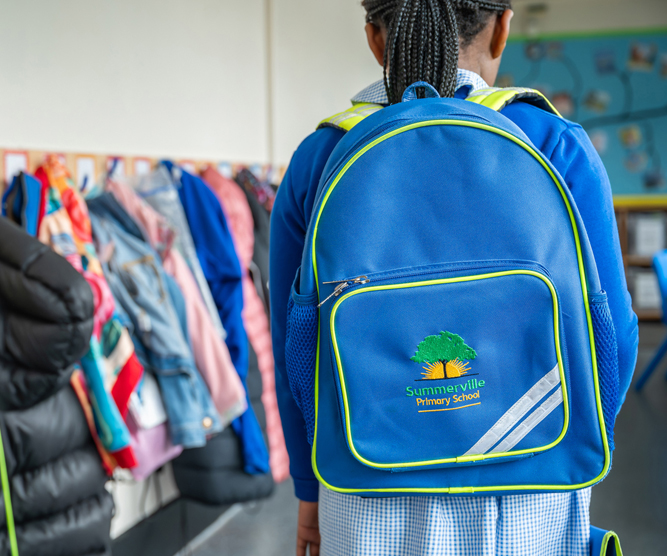 Summerville primary school photography - student with school branded backpack