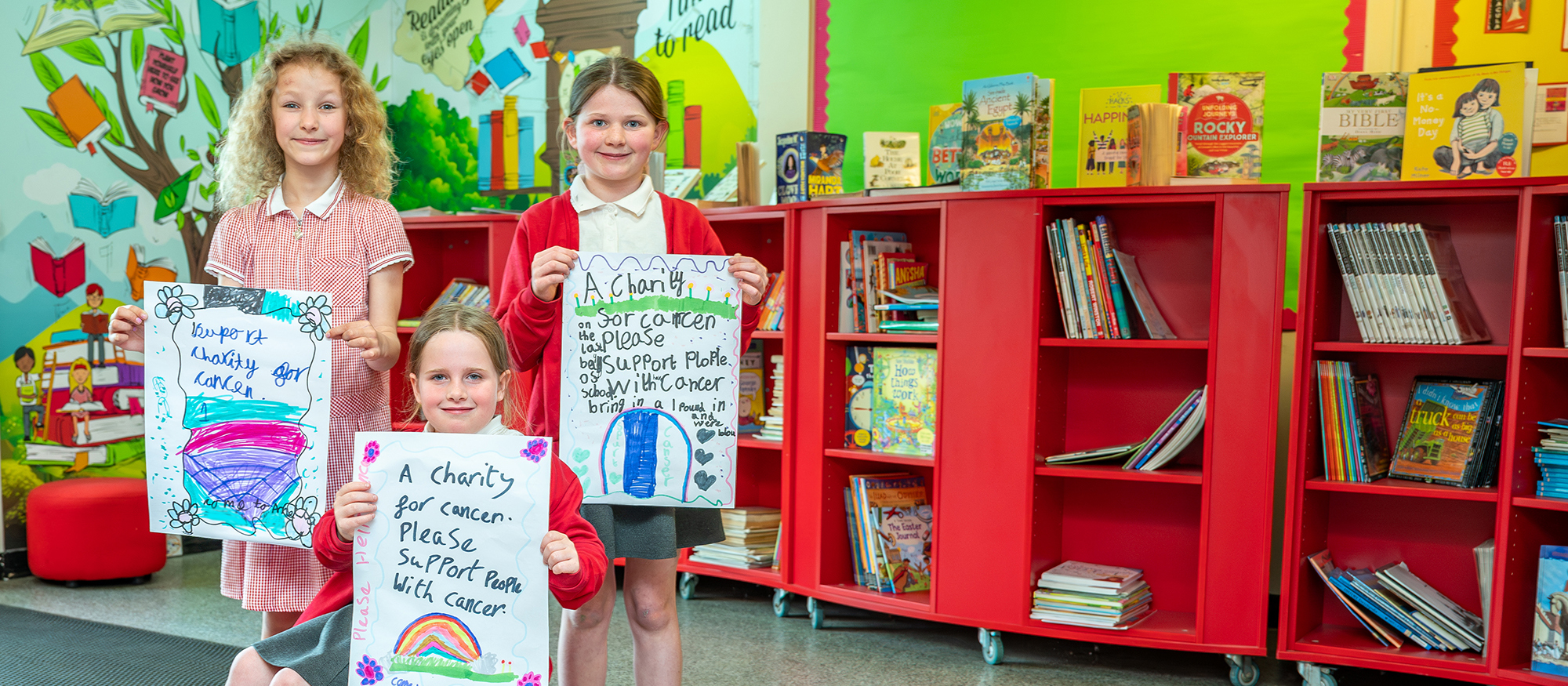 Wharton primary school photography - children holding work
