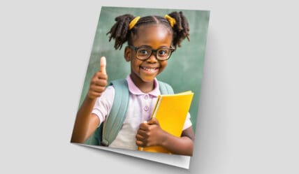 The power of print in education - a card with a young student on the front holding books and with thumbs up